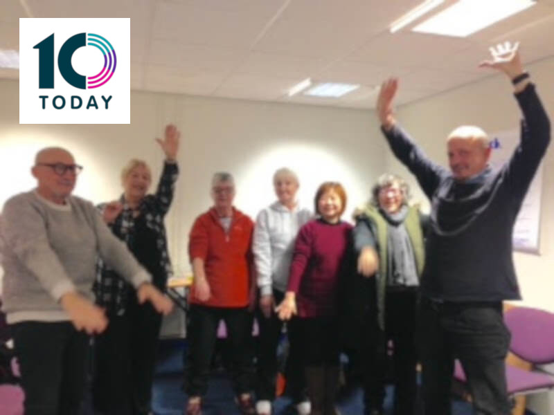 A group of people exercising in jumpers